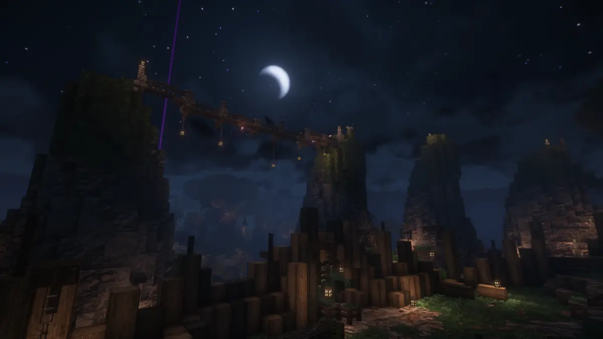 A lantern-lit walkway spanning dark cliffs under a crescent moon.