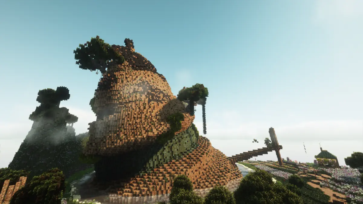 A moss-covered stone dome rising out of a bright green valley.